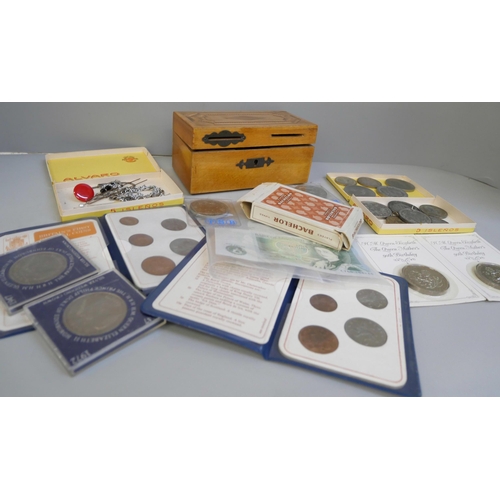 812 - A collection of coins including crowns, a £1 note, a  £5 coin, and two pre 1947 coins