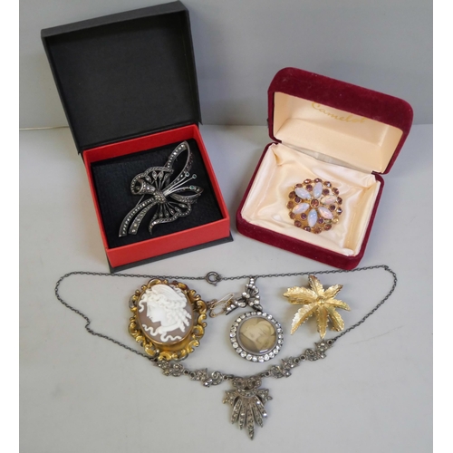 820 - A collection of jewellery including a silver and marcasite brooch and necklace, and other costume br... 