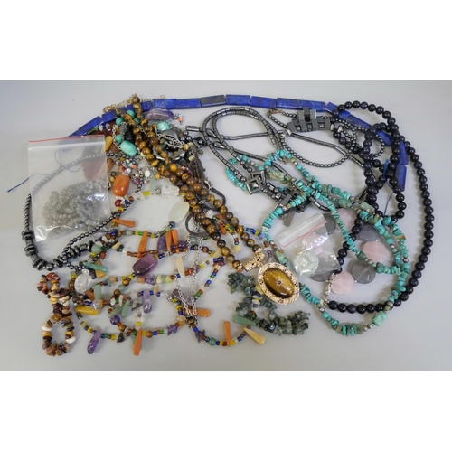 829 - A collection of semi-precious stone jewellery including lapis lazuli beads, turquoise, purple goldst... 