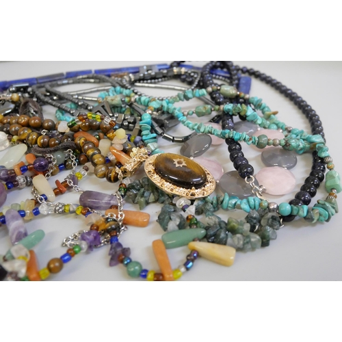 829 - A collection of semi-precious stone jewellery including lapis lazuli beads, turquoise, purple goldst... 