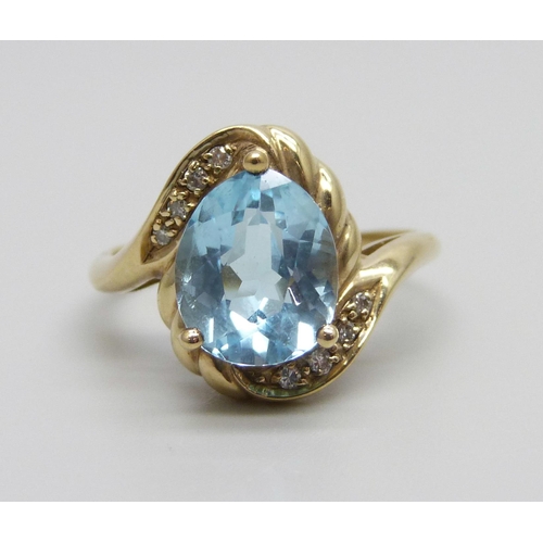 868 - A 9ct gold, topaz and diamond ring, 3.7g, N/O