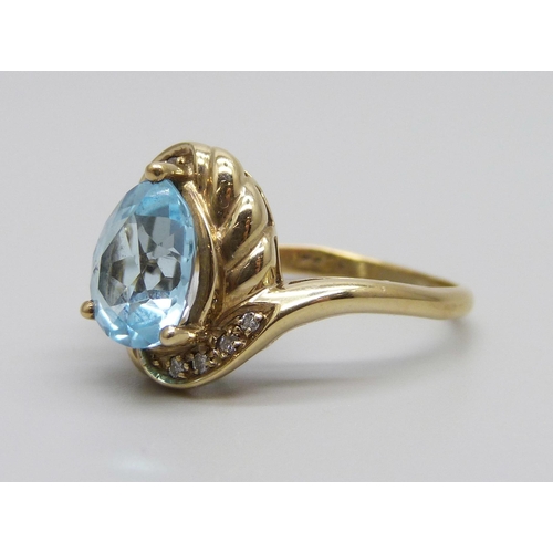 868 - A 9ct gold, topaz and diamond ring, 3.7g, N/O