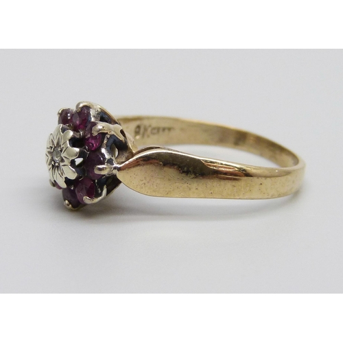 869 - A 9ct gold, ruby and diamond cluster ring, 2.4g, M