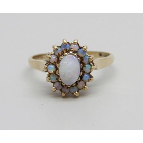 873 - A 9ct gold and opal cluster ring, 2.1g, L/M