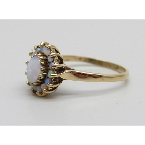 873 - A 9ct gold and opal cluster ring, 2.1g, L/M