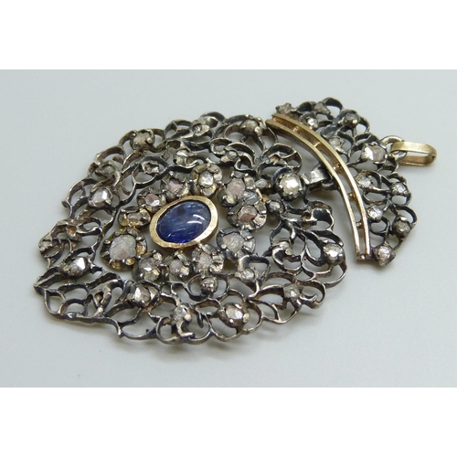 880 - A Georgian white and yellow metal pendant, set with rose cut diamonds and a Ceylon cabochon sapphire... 