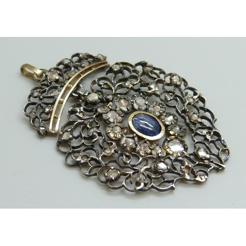 880 - A Georgian white and yellow metal pendant, set with rose cut diamonds and a Ceylon cabochon sapphire... 