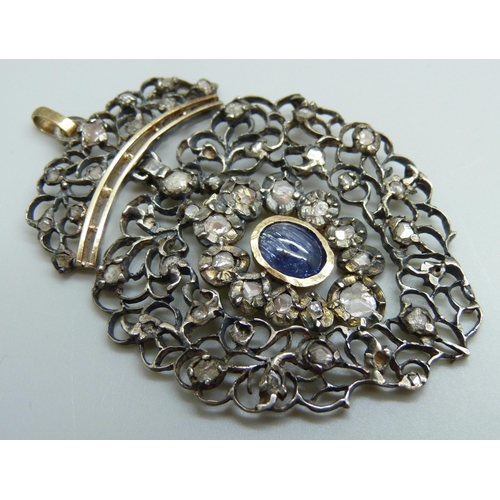 880 - A Georgian white and yellow metal pendant, set with rose cut diamonds and a Ceylon cabochon sapphire... 