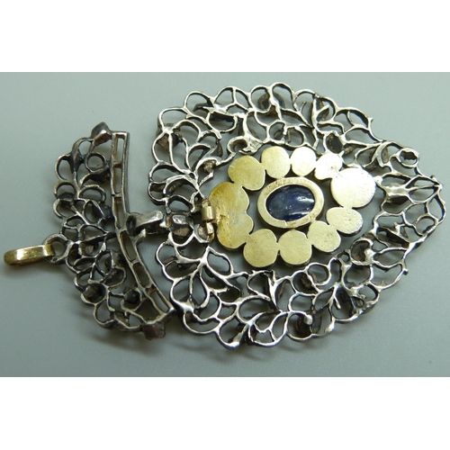 880 - A Georgian white and yellow metal pendant, set with rose cut diamonds and a Ceylon cabochon sapphire... 