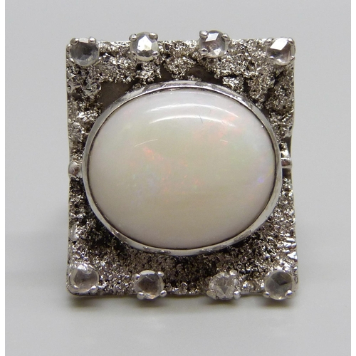 880A - A 9ct white gold Brutalist style ring set with eight old cut diamonds and a large opal, Birmingham 1... 