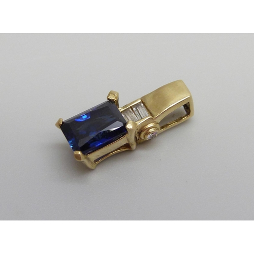 885 - A 14k gold and sapphire pendant, 2.3g, 1.8cm x 0.5cm