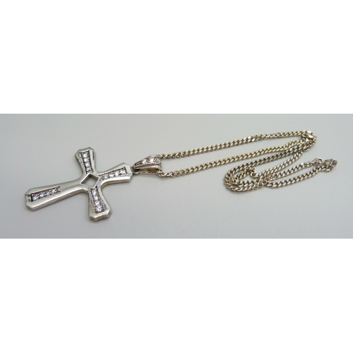 886 - A large silver and cubic zirconia cross pendant on a silver chain, 30g