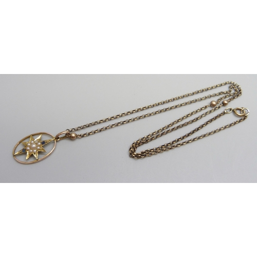 888 - A yellow metal pendant set with seed pearls, stamped 15c, 3.2 x 1.8cm, on a 9ct gold chain, 6.6g tot... 