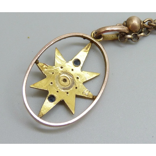 888 - A yellow metal pendant set with seed pearls, stamped 15c, 3.2 x 1.8cm, on a 9ct gold chain, 6.6g tot... 