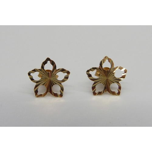 907 - A pair of yellow metal fretwork flower stud earrings, the butterflies marked 375, 0.3g