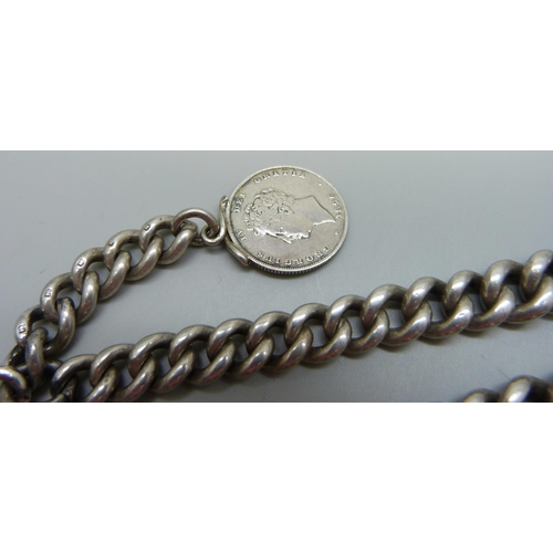 915 - A heavy graduated curb link silver Albert watch chain with a silver coin fob, 134g, 41cm