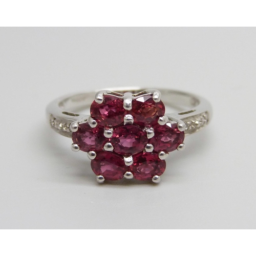 917 - A 9ct white gold ruby and diamond cluster ring, 3.2g, N