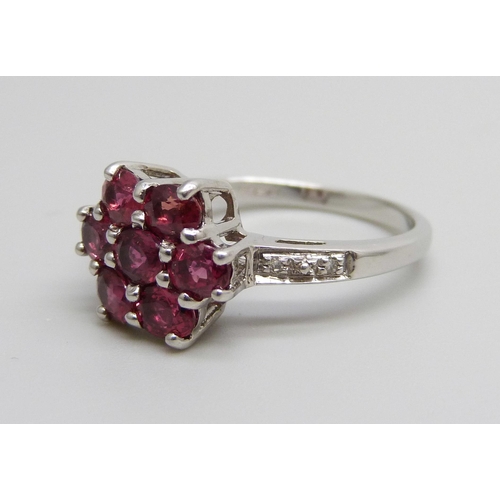 917 - A 9ct white gold ruby and diamond cluster ring, 3.2g, N