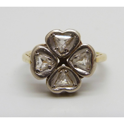 930 - An 18ct gold and four stone diamond quatrefoil design ring, 3.7g, I/J, two diamonds chipped