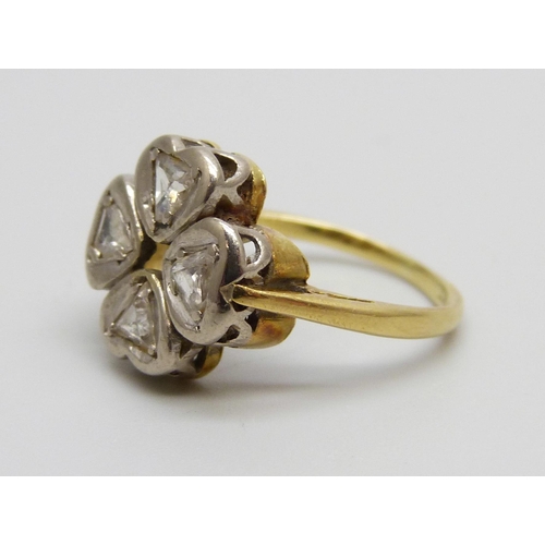 930 - An 18ct gold and four stone diamond quatrefoil design ring, 3.7g, I/J, two diamonds chipped