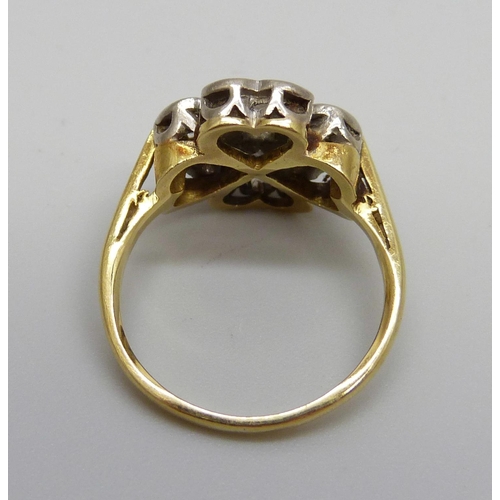 930 - An 18ct gold and four stone diamond quatrefoil design ring, 3.7g, I/J, two diamonds chipped