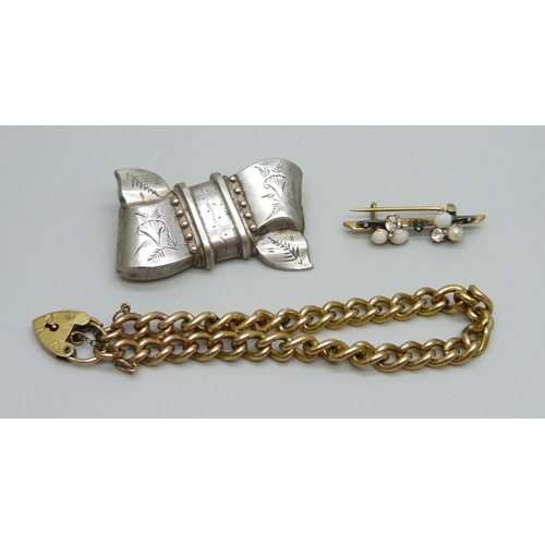 933 - A rolled gold bracelet and two brooches