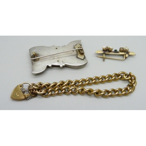 933 - A rolled gold bracelet and two brooches