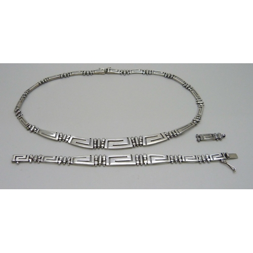 939 - A matching silver necklace and bracelet with Greek Key design, 51g (with spare link)