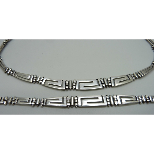 939 - A matching silver necklace and bracelet with Greek Key design, 51g (with spare link)