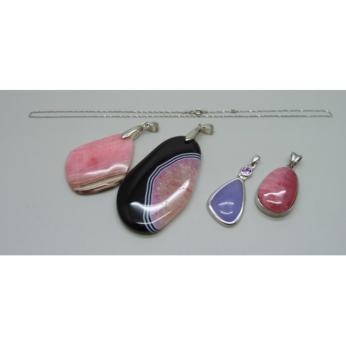 957 - Two silver stone pendants, a silver chain, and two larger plated pendants