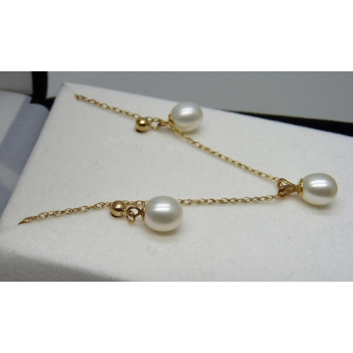 961 - A fine 9ct gold chain with a yellow metal set pearl pendant, and a pair of yellow metal and pearl ea... 