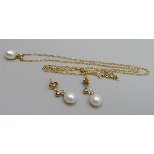 961 - A fine 9ct gold chain with a yellow metal set pearl pendant, and a pair of yellow metal and pearl ea... 