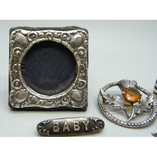 990 - A miniature Silver photograph frame, a silver gate bracelet and three silver brooches (faux pearl br... 