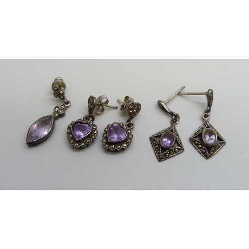 993 - A pair of silver, marcasite and amethyst drop earrings, a single silver earring, and a pair of white... 