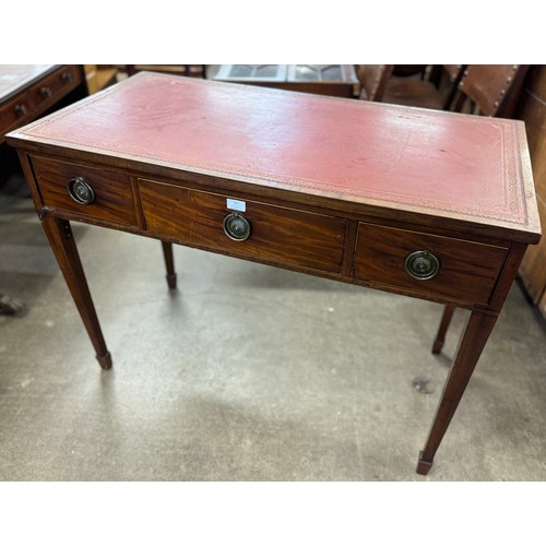 169 - A George III inlaid mahogany and red leather topped three drawer desk