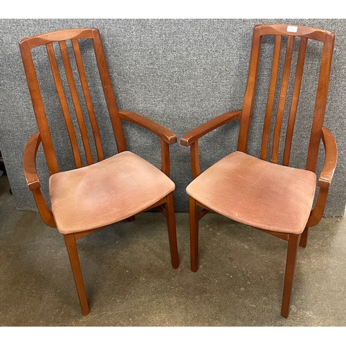 55 - A pair of teak elbow chairs