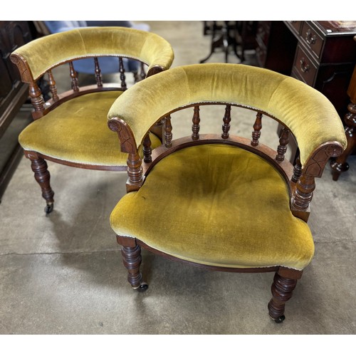 154 - A pair of Victorian carved oak and fabric upholstered tub chairs and a Victorian style armchair