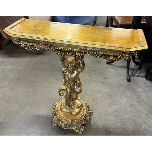 162 - An Italian style gilt cherub console table