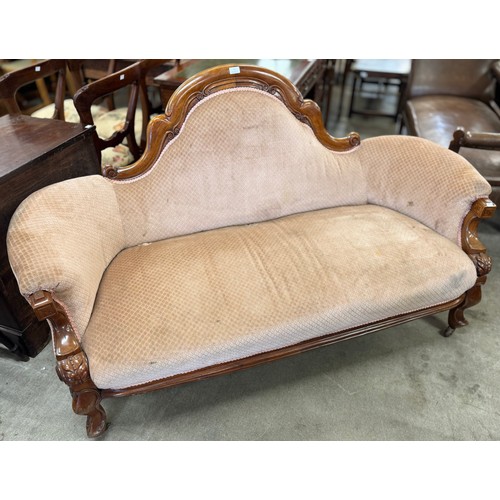 163 - A Victorian carved walnut and fabric upholstered settee