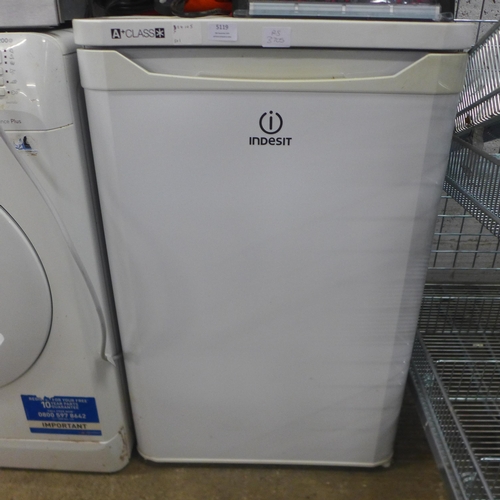 5119 - An Indesit TFAA10 free standing under counter fridge