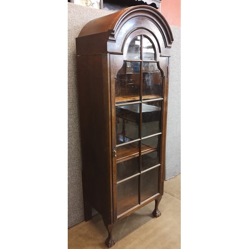 122 - A George III style mahogany domed top single door bookcase