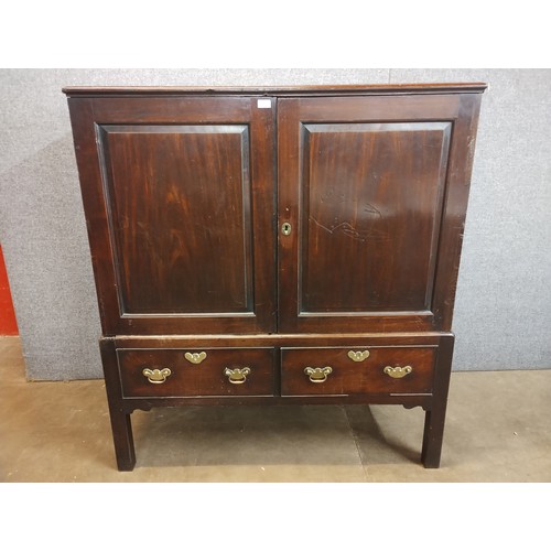 126 - A George III mahogany cupboard on stand