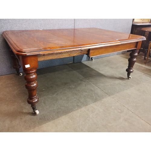 127 - A Victorian mahogany extending dining table