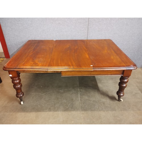 127 - A Victorian mahogany extending dining table