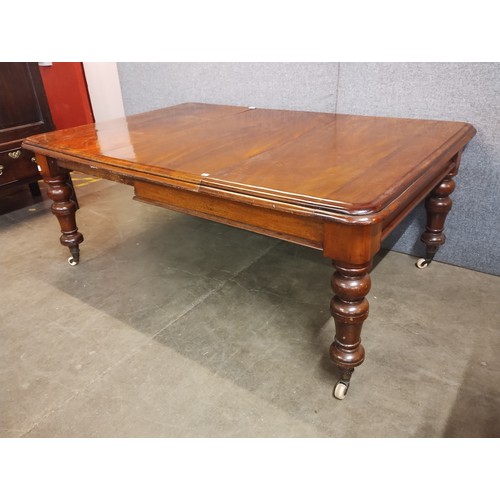 127 - A Victorian mahogany extending dining table