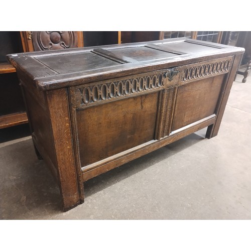 129 - A William III carved oak coffer