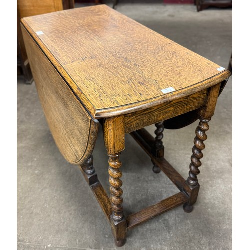 179 - An early 20th Century oak barleytwist gateleg table