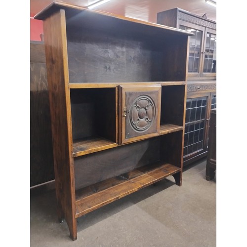 130 - An Arts and Crafts style stained pine open bookcase