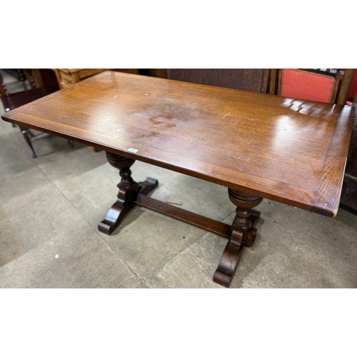 193 - An 18th Century style oak refectory table