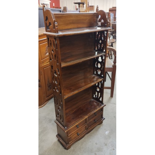 136 - A Chippendale style hardwood open bookcase